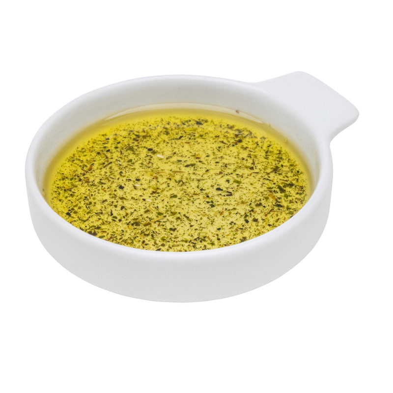 Eine Keramikschale mit Leindotteröl mit Gewürzen.