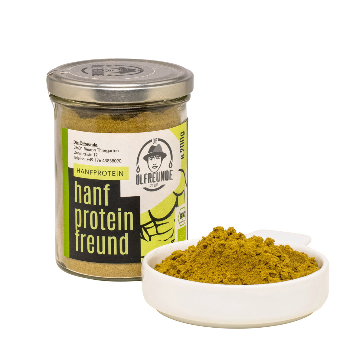 Ein Glas mit 200g Bio-Hanfprotein der Marke Die Ölfreunde, daneben eine Schale mit Bio-Hanfprotein.