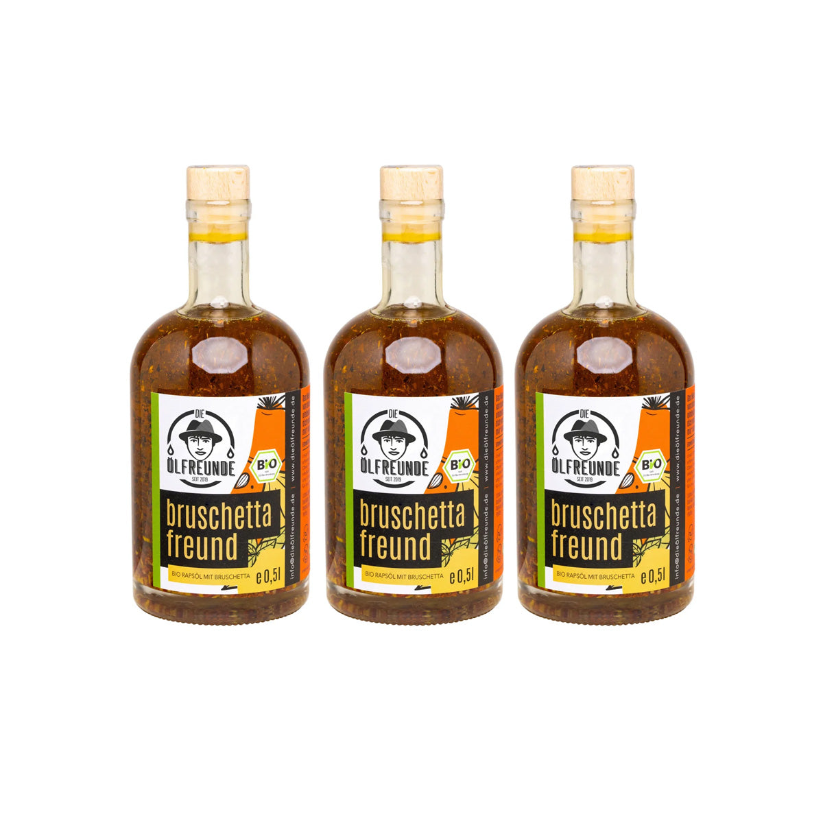 Drei Flaschen mit je 500ml kaltgepresstes Bio-Rapsöl mit Bruschettagewürz von Marke Die Ölfreunde.