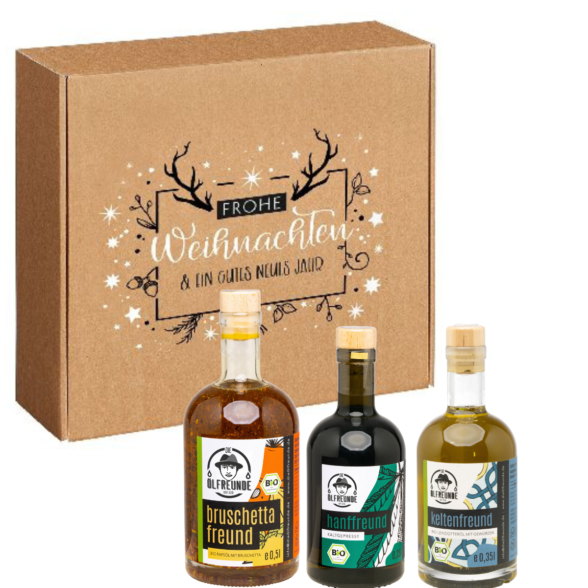 Eine Flasche Bruschetta-Öl, Hanföl und Leindotteröl mit Gewürzen von der Marke Die Ölfreunde, vor einer Weihnachts-Geschenkeverpackung.