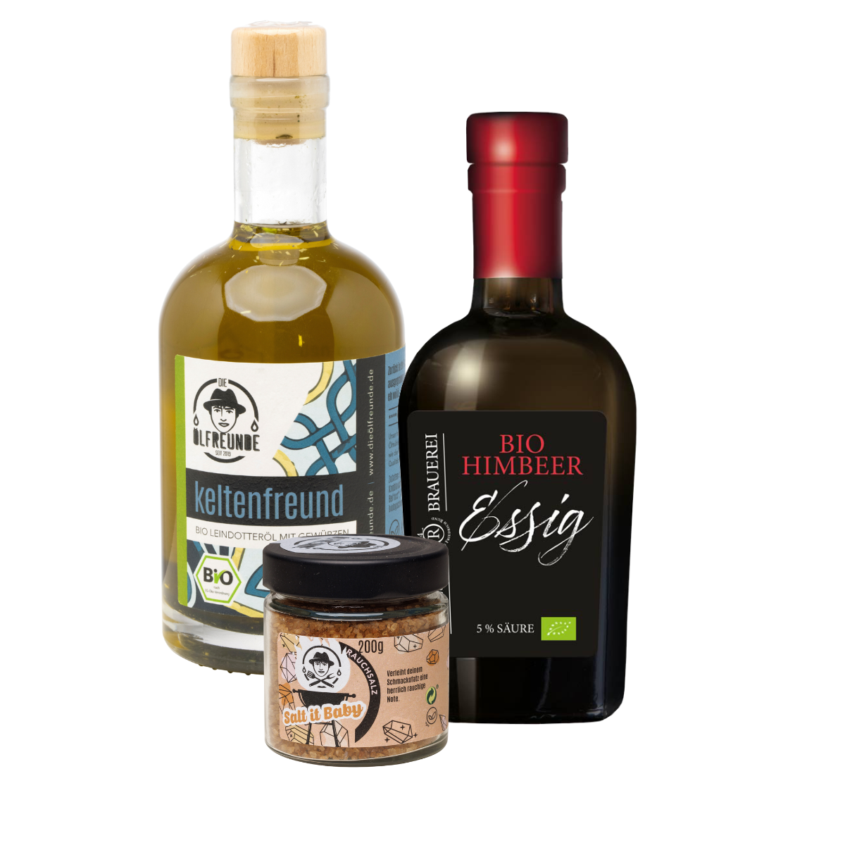 Drei Produkte nebeneinander. Eine Flasche Bio Leindotteröl mit Gewürzen und ein Glas mit 200g Rauchsalz der Marke Die Ölfreunde, daneben eine Flasche Bio Himbeeressig der Marke Die Essig Brauerei.