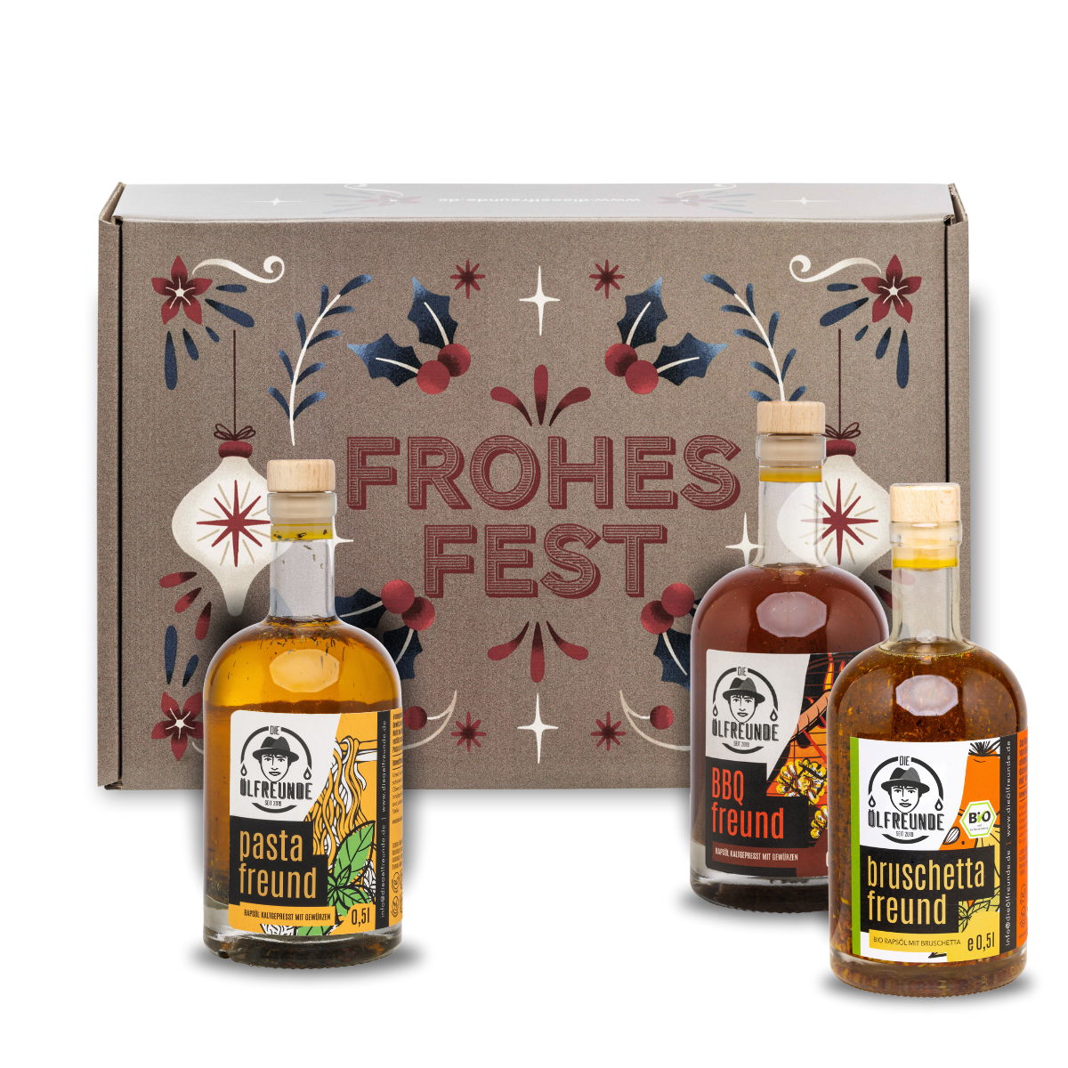 Pasta-Öl, BBQ-Öl und Bruschettaöl der Marke Die Ölfreunde, vor einer Weihnachts-Geschenkeverpackung.