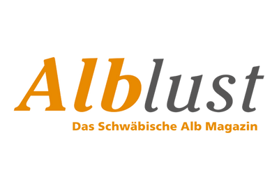 Das Logo der Alblust- Das Schwäbische Alb Magazin, in gelb, grauer Farbe.